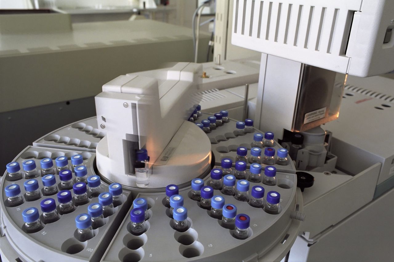 Home High-tech laboratory equipment with multiple vials in a scientific research facility.