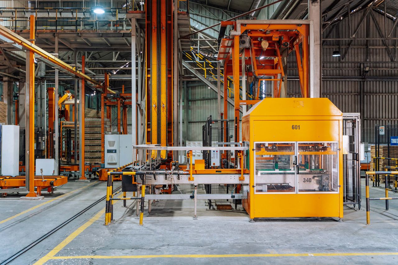 Home Detailed view of machinery in an operational glass factory in Dar es Salaam.